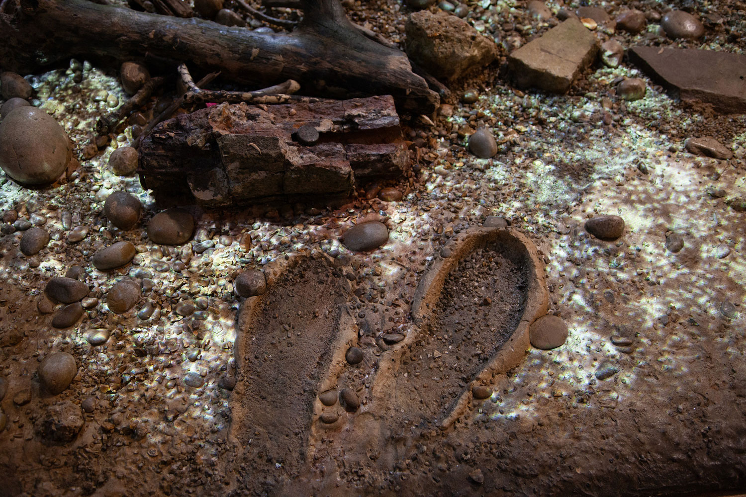 A photo showing projected sparkles mapped onto a recreation of the Thames foreshore.
