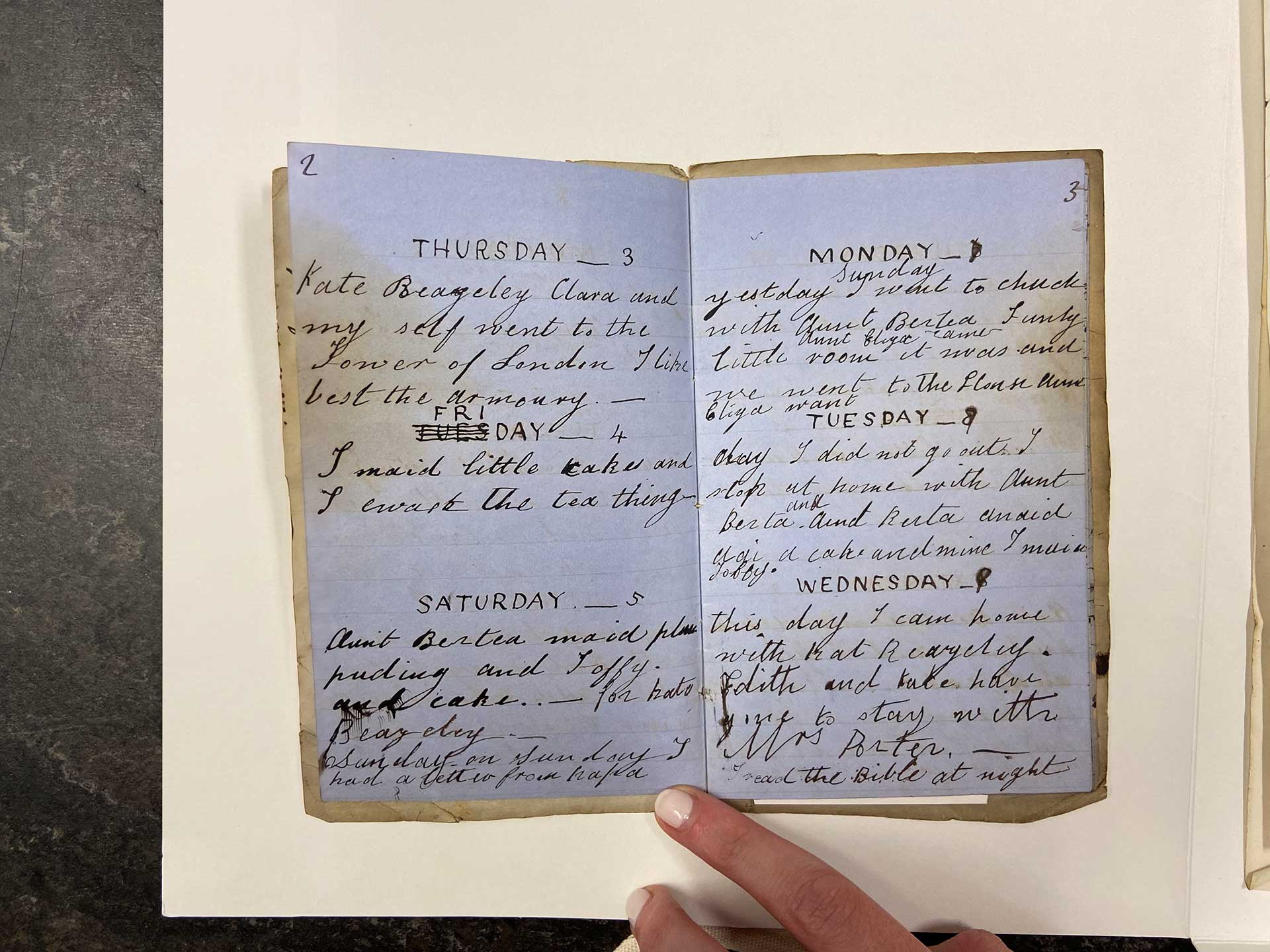 A photo taken during a visit to the National Gallery Archive. In the middle of the photo is Ralph Nicholson Wornum's open diary from the 1800s. Both pages contain hand written script capturing the daily happenings of the gallery.